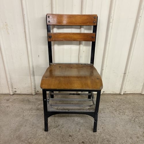 Vintage Industrial Steel and Wood Side Chair with Integrated Book Rack: This vintage industrial side chair, attributed to American manufacturers such as UHL Steel or Envoy, features a black-painted metal frame with contoured hardwood components. The seat and two-slat back