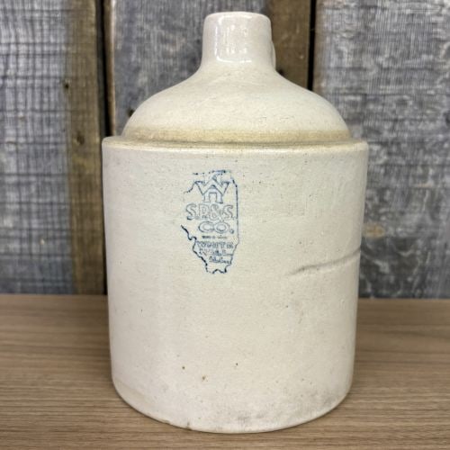 S.P. & S. Co. White Hall Illinois One Gallon Stoneware Shoulder Jug: An antique salt-glazed stoneware shoulder jug manufactured by the S.P. & S. Co. (Smith, Page & Smith Company) of White Hall, Illinois. The vessel features a cylindrical body, a rounded shoulder, and a