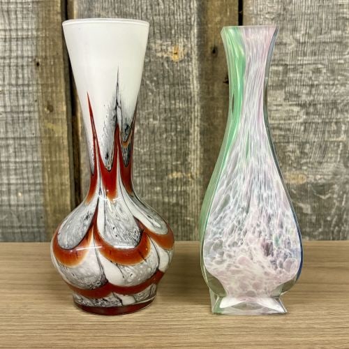 Two Hand Blown Art Glass Vases Including a Carlo Moretti Style Pulled Feather Bud Vase: This lot features two hand-blown art glass vases showcasing distinct mid-century decorative styles. The first is an opaline glass baluster-style bud vase attributed to Carlo Moretti, Murano. The vesse