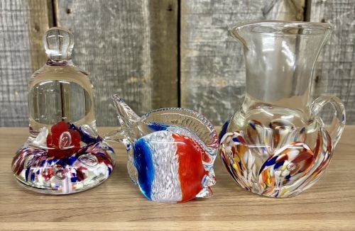 A Trio of Art Glass Pieces Including a Saint-Louis Commemorative Paperweight, a Fish Figurine, and a: This lot consists of three hand-blown art glass items. The first item is a solid crystal paperweight in the shape of a bell, produced by Saint-Louis (Compagnie des Cristalleries de Saint-Louis). The i