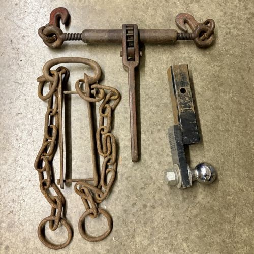 A Trio of Heavy-Duty Rigging and Towing Tools Including Ratchet Load Binder, Chain Assembly, and: This lot comprises three heavy-duty industrial tools used for cargo securement, rigging, and towing. The first item is a ratchet-style load binder designed for tensioning transport chains on flatbed t