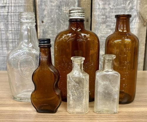 A Collection of Assorted Vintage Clear and Amber Glass Bottles (1 of 6)