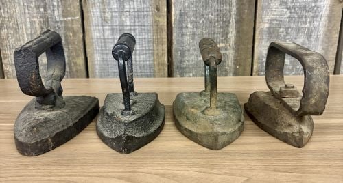 A Collection of Four Antique Cast Iron Sad Irons (1 of 7)