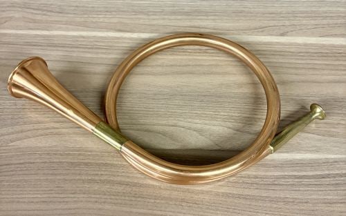 Vintage Copper and Brass Circular Hunting Horn Made in England: This hunting horn is constructed with a circular copper tube and brass components. The piece features a brass mouthpiece and a brass sleeve at the bell joint. The brass sleeve is stamped with the word