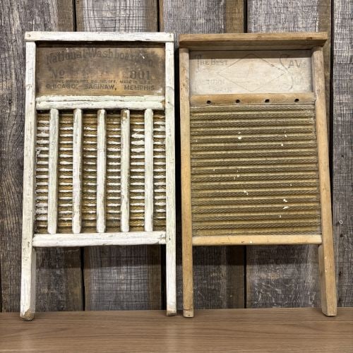 Two Vintage Wood and Metal Washboards by National Washboard Co. and Monarch Mfg. Co.: This lot consists of two vintage American-made washboards from the early to mid-20th century, constructed with wooden frames and corrugated brass-toned metal rubbing surfaces. The first washboard is a