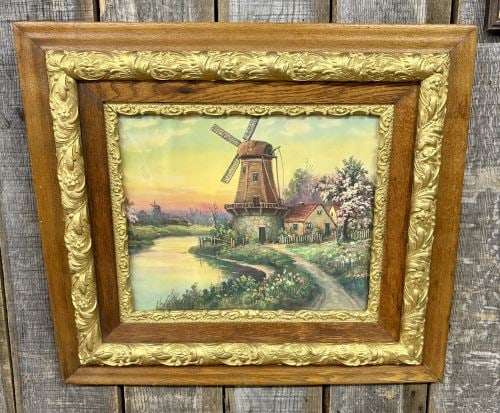 Dutch School, 20th Century, 'Landscape with Windmill and Cottage': A framed work on board depicting a traditional Dutch landscape scene. The composition is centered on a large windmill with a stone base and timber-clad upper section, positioned adjacent to a small co