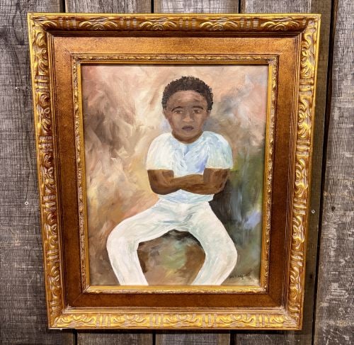 John F. Schnabel, Portrait of an African American Child, Oil on Canvas: This original oil on canvas portrait depicts a seated African American child with arms crossed, dressed in a white shirt and pants. The work is executed in a painterly, impressionistic style with visi
