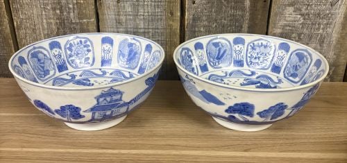A Pair of Chinese Blue and White Export Style Porcelain Landscape Bowls: A pair of large porcelain bowls featuring hand-painted underglaze blue decoration in the Chinese export style. The interior of each bowl is centered with a circular medallion depicting a traditional r