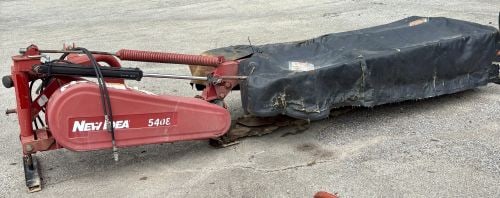 New Idea 5408 Eight Disc Mower: New Idea model 5408 disc mower manufactured by AGCO in Duluth, Georgia, USA. This agricultural implement is constructed with a red-painted steel frame and a six-disc rotary cutting bed. The unit is de