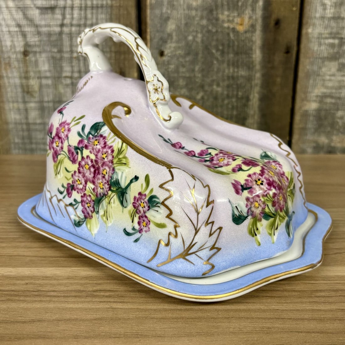 American Limoges China Company Porcelain Covered Cheese Dish: Manufactured by the American Limoges China Company of Sebring, Ohio, this two-piece porcelain serving set consists of a wedge-shaped ventilated cover and a matching rectangular underplate. The set fea