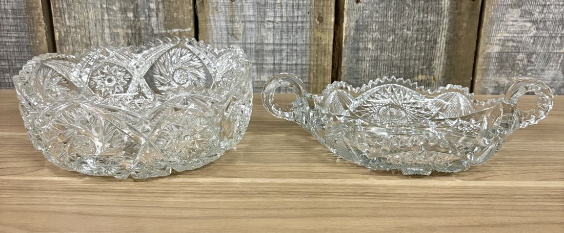Two Pieces of American Brilliant Period Cut Glass Including Centerpiece Bowl and Handled Nappy: This lot consists of two pieces of lead crystal cut glass from the American Brilliant Period, dating between 1876 and 1917. The first item is a deep circular centerpiece bowl featuring a scalloped saw