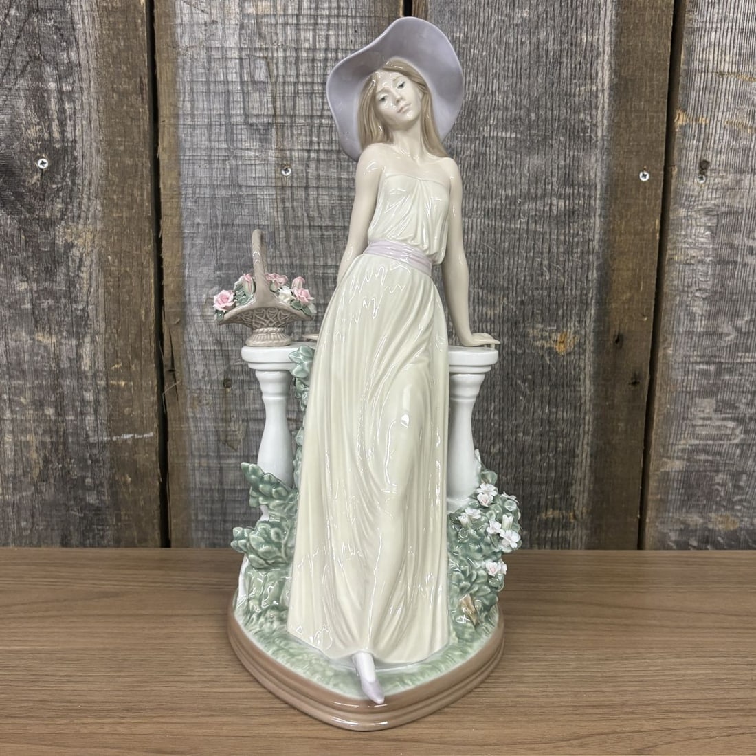 Lladro Time for Reflection Porcelain Figurine Model 05378: A large LladrÛ porcelain figurine titled Time for Reflection (Spanish title: Dama Reflexiva), model number 05378. This high-gloss glazed piece depicts a slender young woman in a pensive pose, leaning