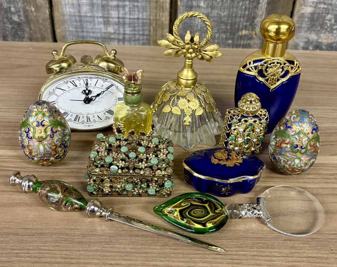 Blessing West German Alarm Clock, Yu Feng Perfume Bottles & Vanity & Desk Accessories: This collection consists of various vintage vanity and desk objects featuring ornate metalwork and art glass components. The set includes an oval twin-bell alarm clock with a brass-toned metal casing,