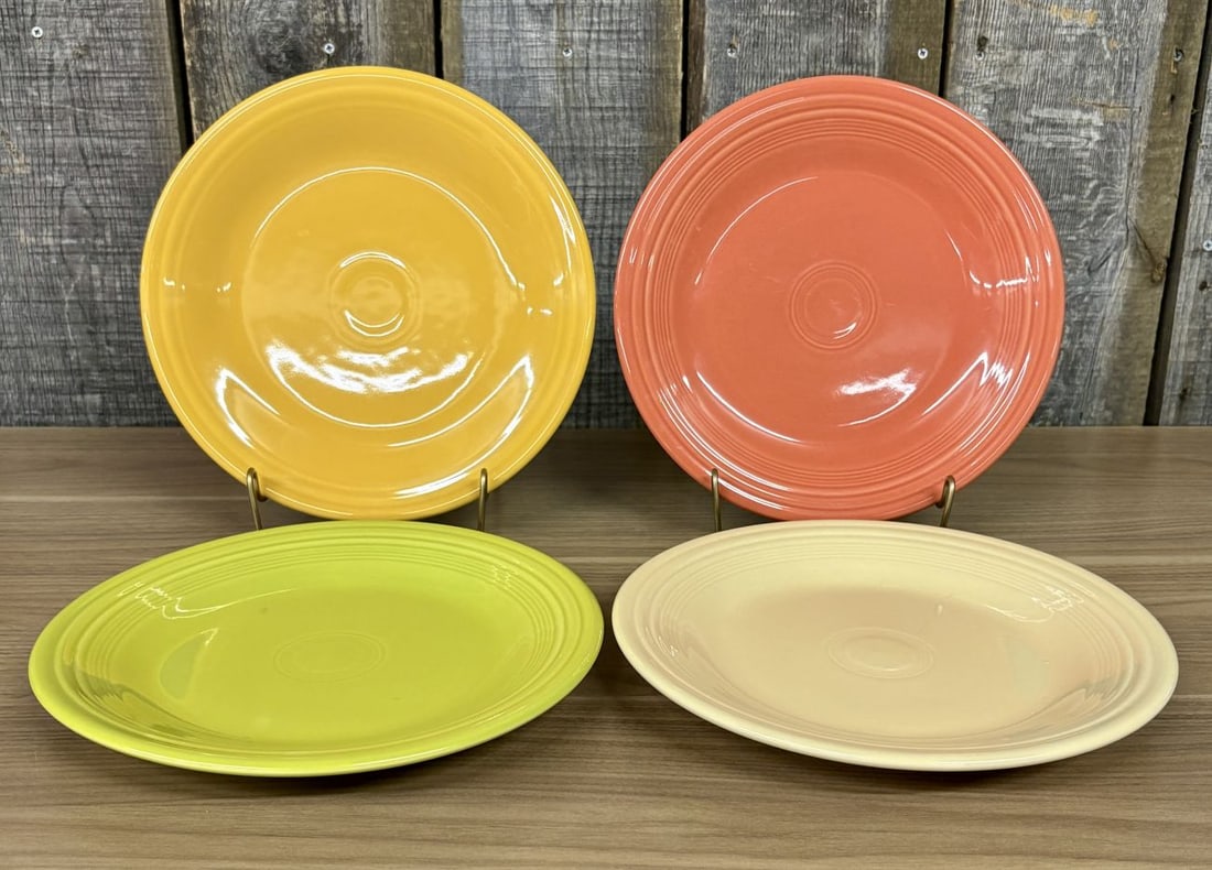 A Set of Homer Laughlin Fiesta Dinner Plates: This set consists of contemporary dinner plates from the Fiesta line, manufactured by the Homer Laughlin China Co. Crafted from glazed vitrified china, each plate features the iconic design of concent
