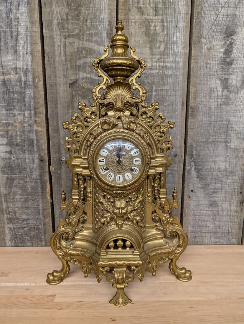 Italian Imperial Rococo Style Gilt Brass Mantel Clock with Franz Hermle Movement: An Italian mantel clock featuring a case marked Imperial and a mechanical movement manufactured by Franz Hermle. The ornate case is constructed from cast brass with a gold-toned finish in the Rococo r