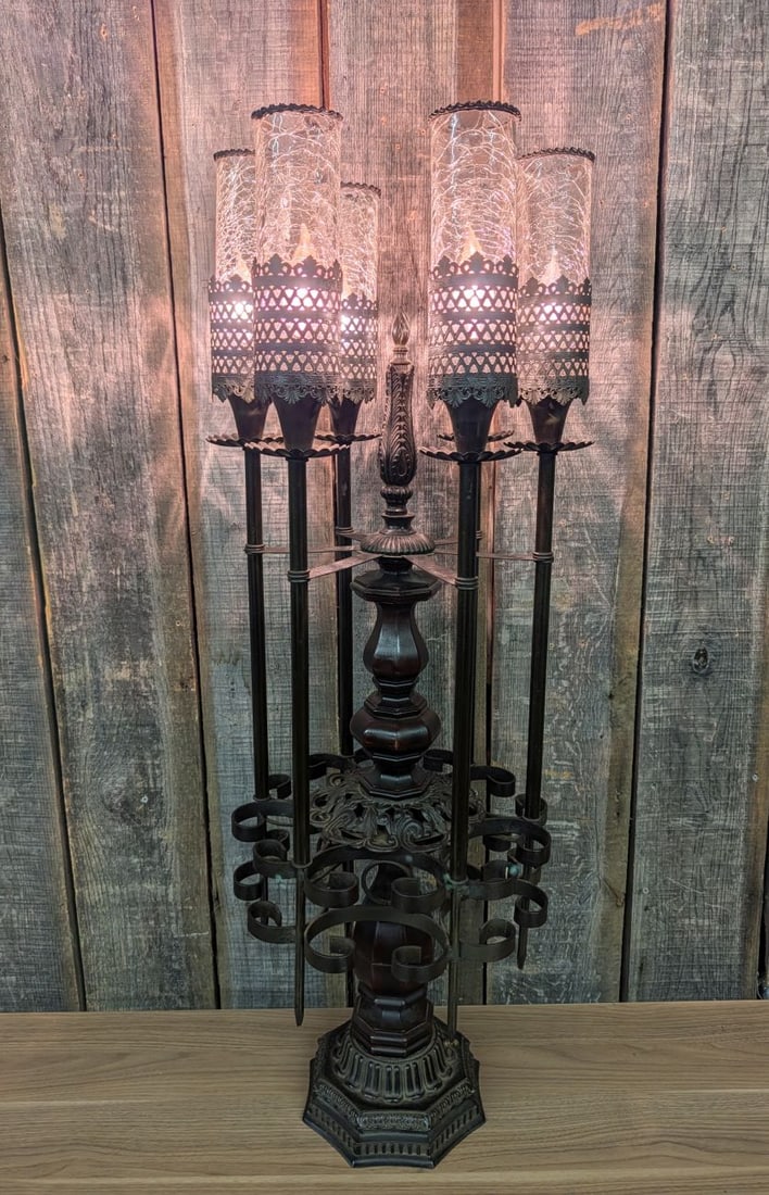 Mediterranean Spanish Revival Six Light Candelabrum Table Lamp: A large Mediterranean or Spanish Revival style six-light candelabrum table lamp. The piece is constructed with a central turned and stained wood column accented by a cast metal foliate finial and a he