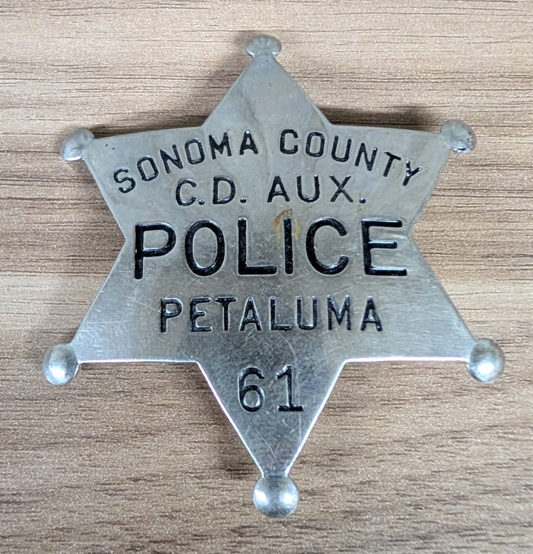 Sonoma County Civil Defense Auxiliary Police Badge No. 61 Petaluma California: This is a mid-20th century law enforcement badge designated for the Sonoma County Civil Defense Auxiliary Police, specifically for the city of Petaluma, California. Dating from the Cold War era (circa