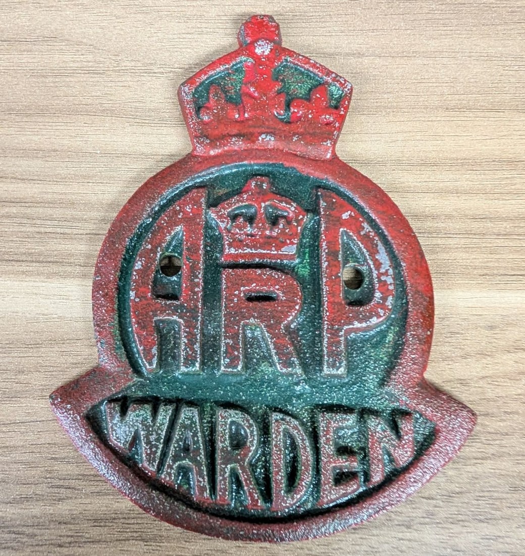 World War II British Air Raid Precautions ARP Warden Cast Metal Post Plaque: A World War II era British Air Raid Precautions (ARP) Warden plaque, traditionally used for identifying warden posts or for mounting on vehicles. The plaque is constructed of heavy cast metal in a shi