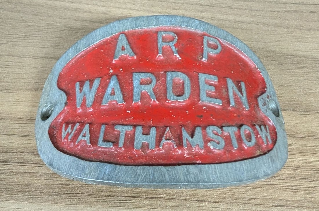 World War II British Air Raid Precautions ARP Warden Walthamstow Cast Metal Plaque: This is a British World War II era cast metal identification plaque for an Air Raid Precautions (ARP) Warden in the London Borough of Walthamstow. The item is constructed of cast metal, likely aluminu
