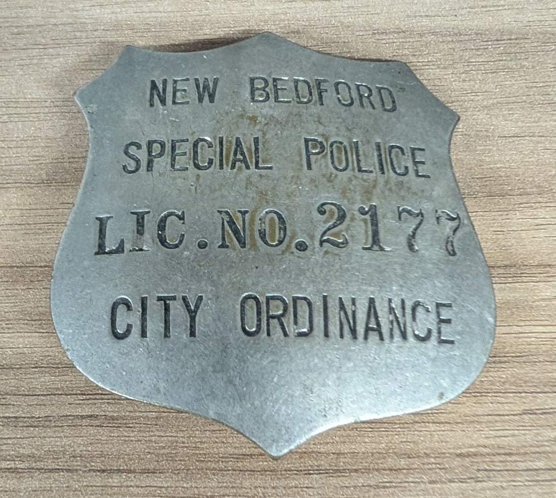 Mid-20th Century New Bedford Massachusetts Special Police Badge License No. 2177: A shield-shaped obsolete service badge issued for a Special Police officer in New Bedford, Massachusetts. The badge is constructed from stamped base metal, featuring a nickel or chrome-plated finish. 
