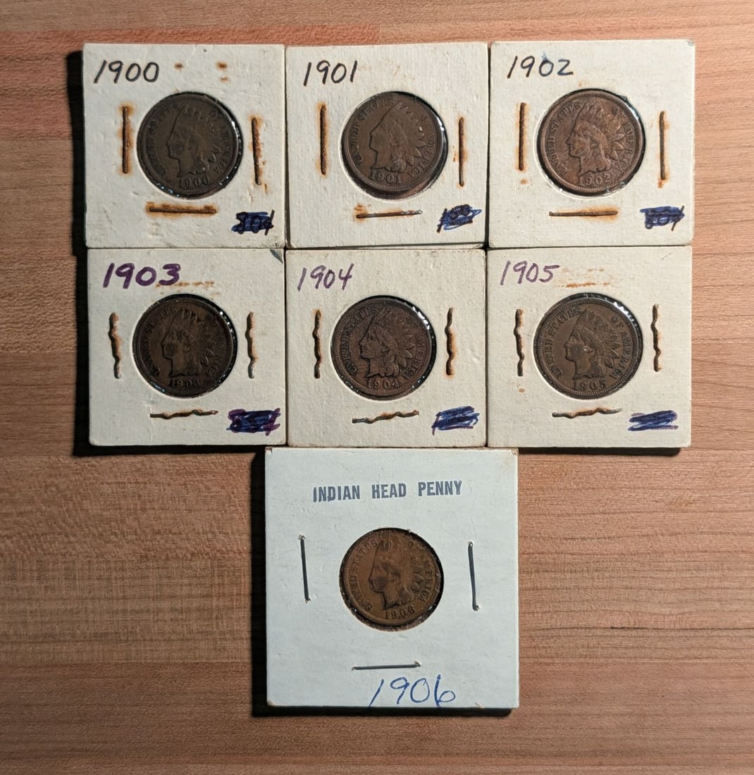 A Collection of Seven US Indian Head Pennies, 1900-1906: This group consists of seven US one-cent coins, popularly known as Indian Head pennies, forming a consecutive year set from 1900 through 1906. Each coin is struck in bronze (95 percent copper, 5 perce