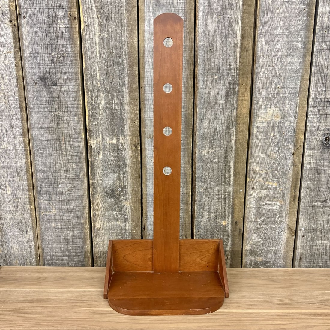 Shakertown at Pleasant Hill Cherry Wood Adjustable Candle Stand: This adjustable candle stand was produced by the woodworking shops at Shakertown at Pleasant Hill, Kentucky. The piece is constructed from solid cherry wood with a warm reddish-brown finish. It featur