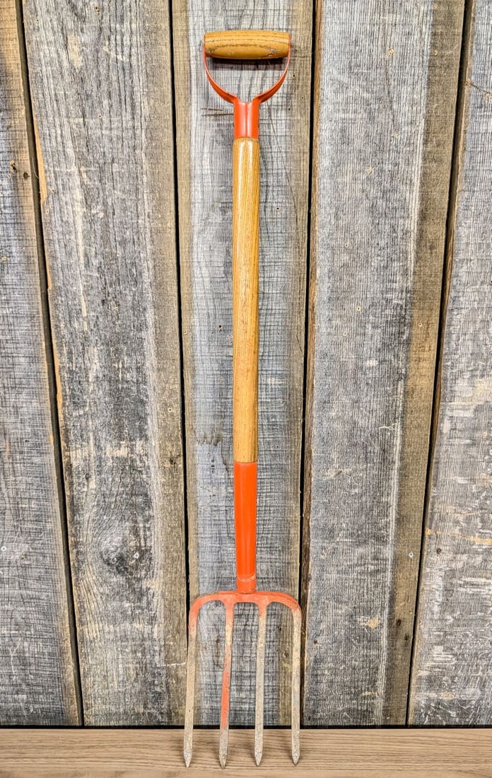 Belknap Mohawk 4-Tine Forged Steel Spading Fork with D-Handle: A vintage garden digging or spading fork produced by the Belknap Hardware and Manufacturing Company of Louisville, Kentucky. The tool is part of the Mohawk product line and features a forged steel hea