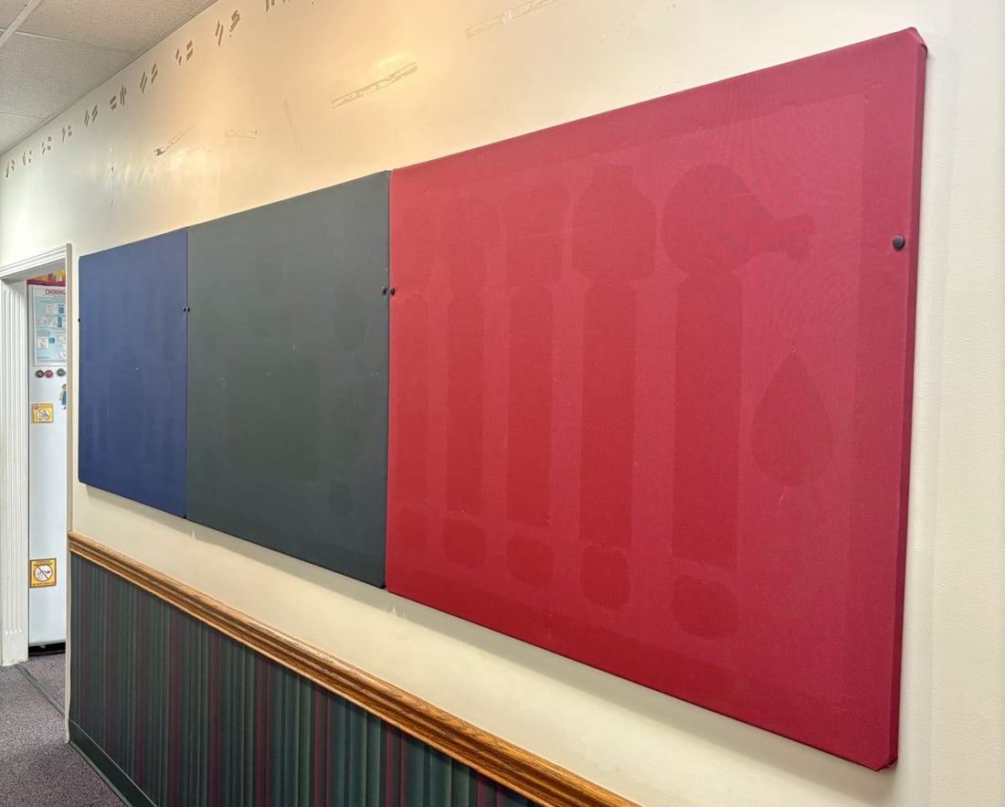 Trio of Large Fabric-Wrapped Wall Panels: Three fabric-wrapped wall panels, including one navy blue, one charcoal gray, and one red panel. Each panel consists of a woven synthetic fabric stretched over a rigid rectangular substrate, intended 