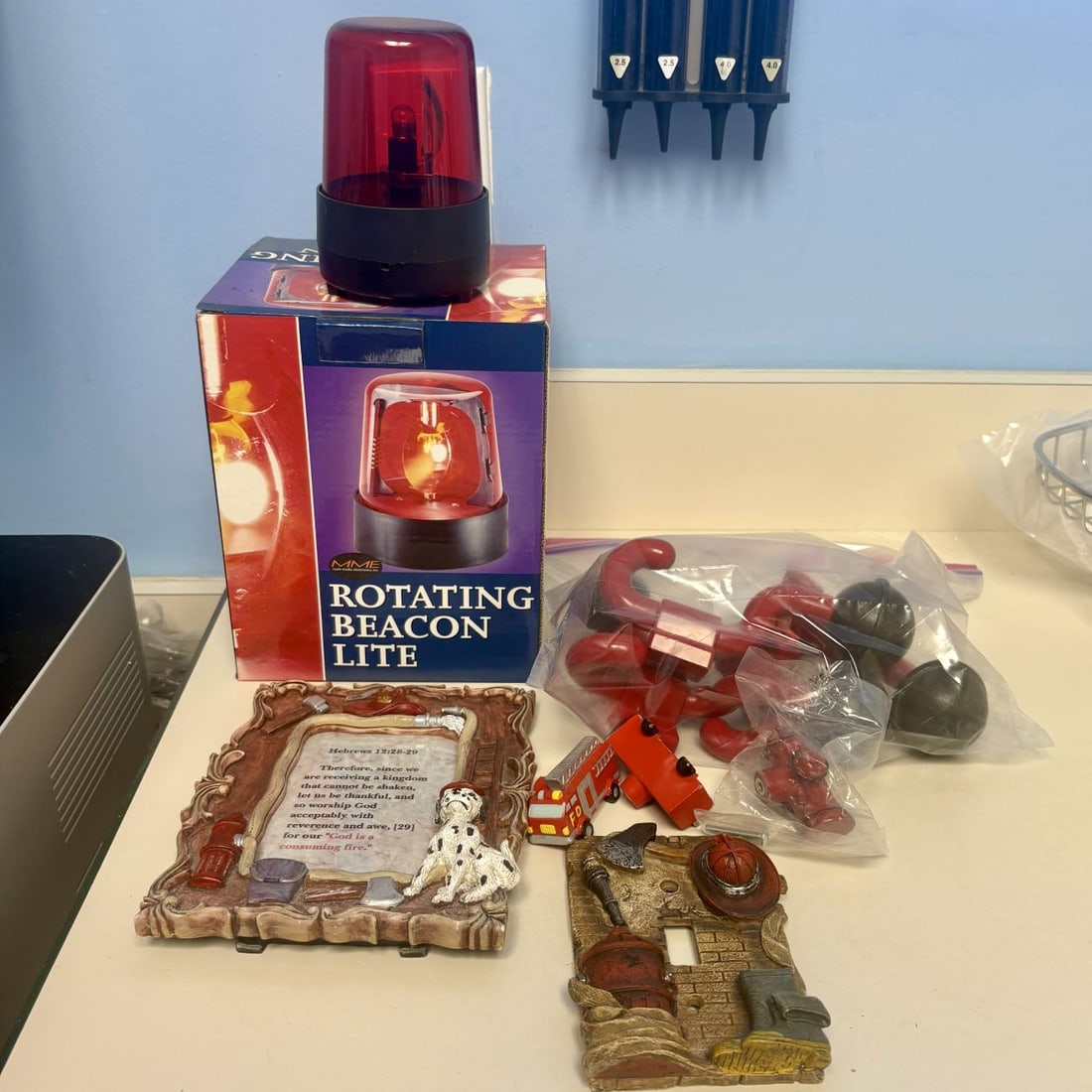 A Collection of Firefighter-Themed Decorative Items and Toys including an MME Rotating Beacon Lite (1 of 5)