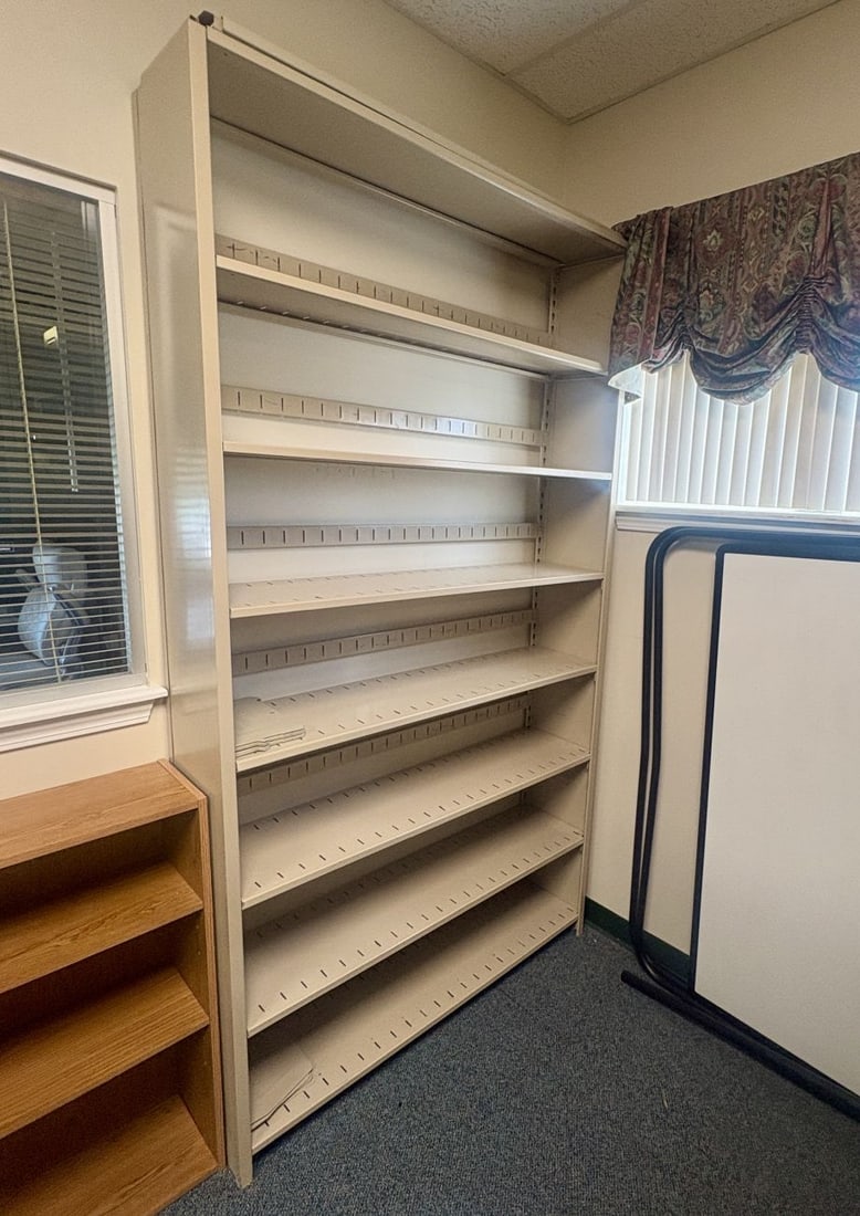 Tennsco Beige Metal Open Face Storage Shelving Unit: FOR PICK UP ONLY (Monday 9/28/26 and Tuesday 9/29/26 ONLY) - CAN NOT SHIP! This is a tall, industrial-grade open-face storage shelving unit constructed from beige-painted metal. The structure consists