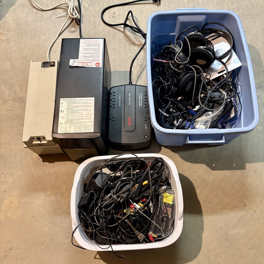 Assortment of APC and Tripp Lite Uninterruptible Power Supplies with Peripheral Cables and (1 of 5)