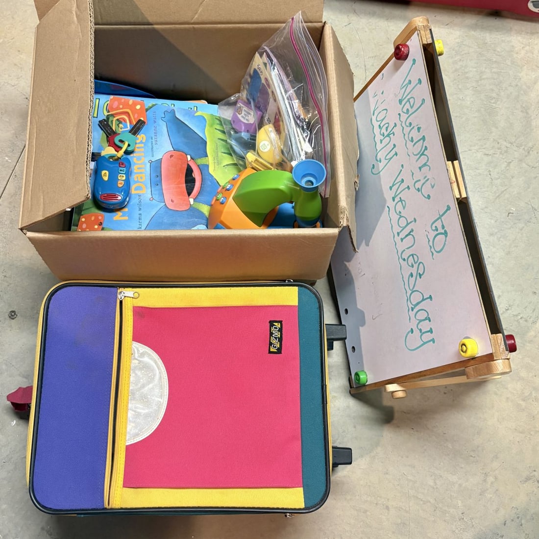 Assortment of Children's Items Including a Gizmo Suitcase, Tabletop Easel, and Toys (1 of 6)