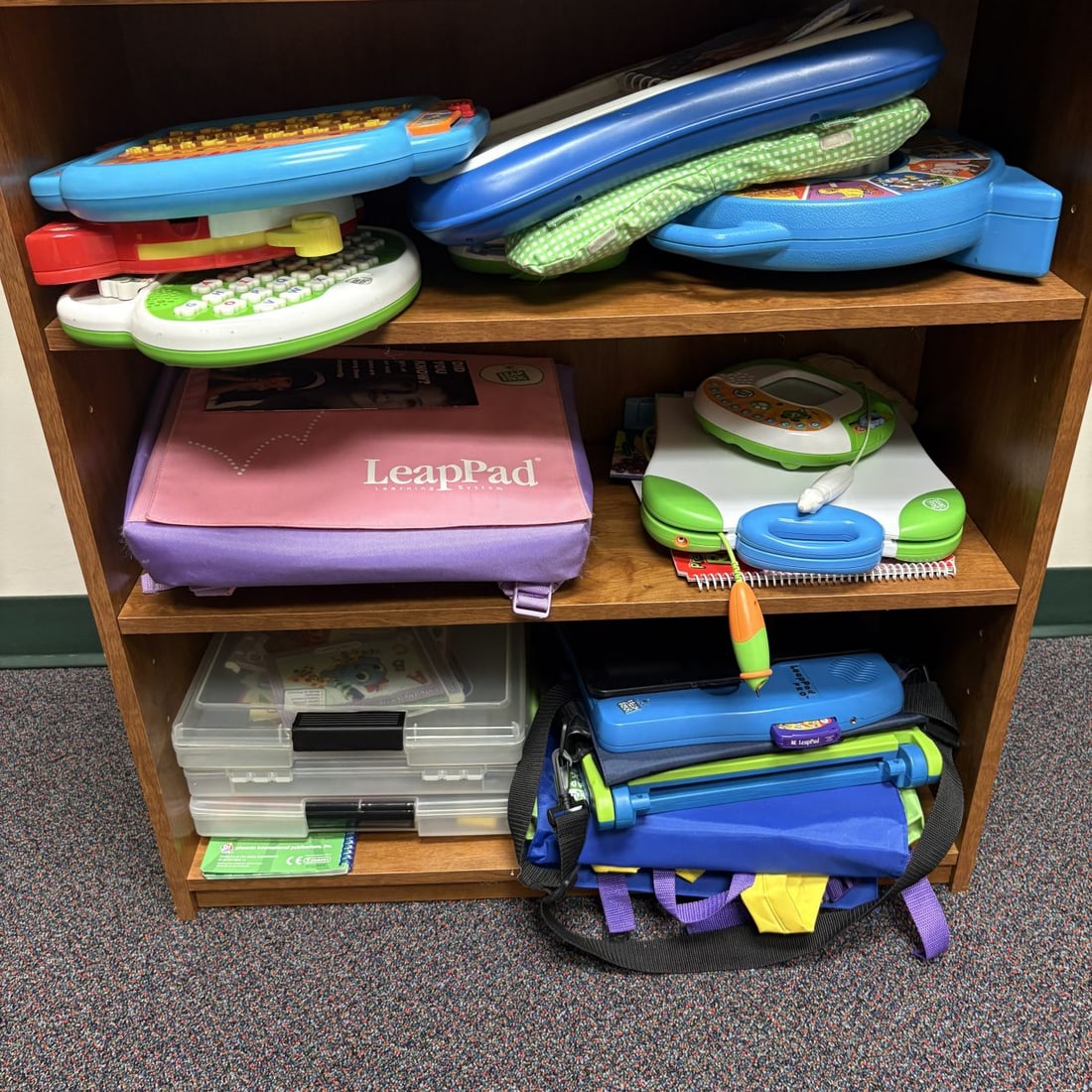 A Collection of LeapFrog Educational Toys, a Welch Allyn Pediatric Diagnostic Center, and a Three-Sh - 2