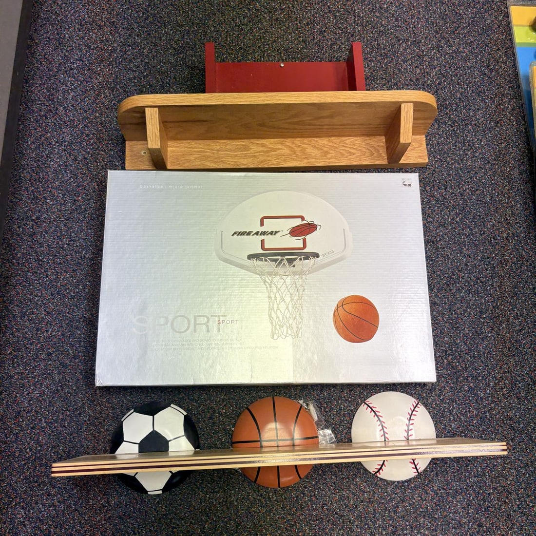 A Group of Wall Shelves and a Fire Away Sports Basketball Micro Jammer: A group of four home organization and decor items comprising a boxed basketball set and three wall-mounted shelves. The basketball set is a Fire Away Sports Basketball Micro Jammer in its original