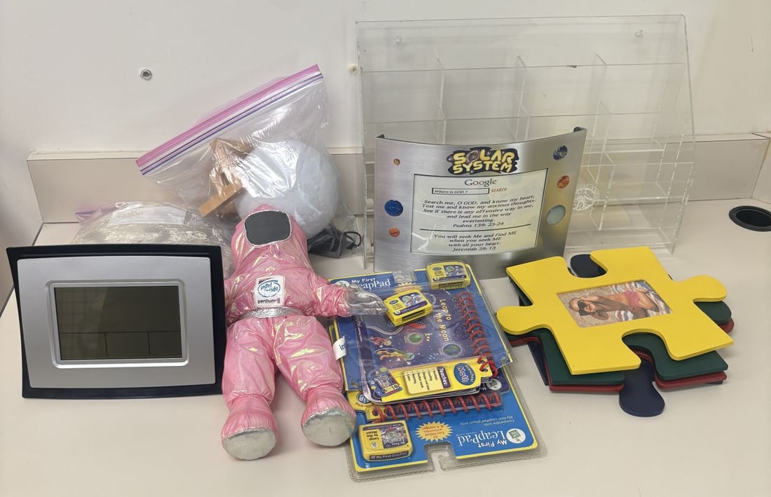 Lot including Intel Pentium II BunnyPeople advertising plush and LeapFrog educational toy set: A collection of vintage advertising, educational, and professional desktop items. The center feature is a pink iridescent fabric BunnyPeople plush doll wearing a space suit with silver metallic trim