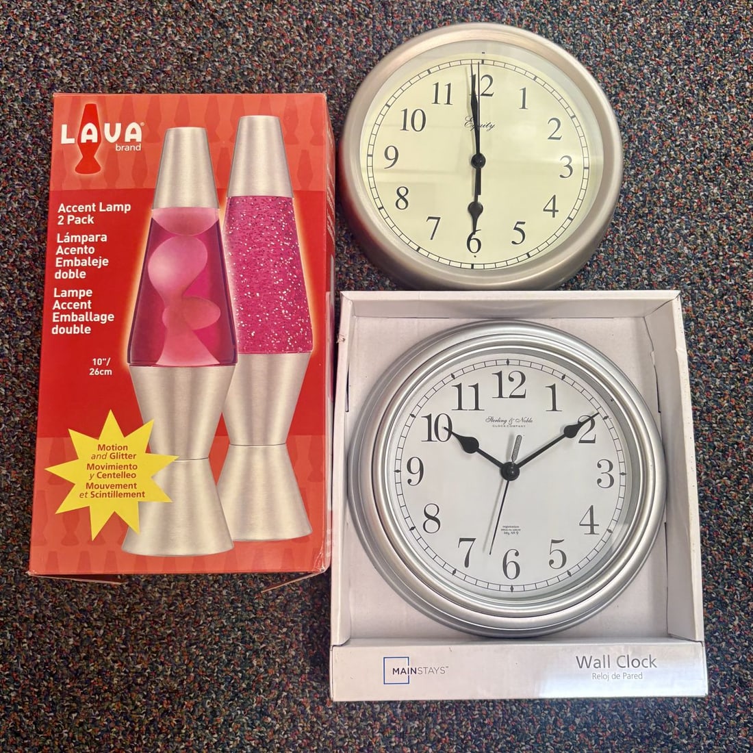 Lava Lamp Set, Mainstays Wall Clock & Equity Wall Clock: This lot features three contemporary decorative items for the home. Included is a Lava Brand Accent Lamp 2 Pack in its original red retail packaging. The set consists of two 10-inch tall lamps: one