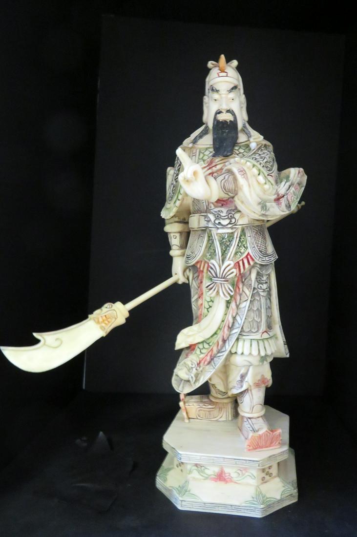 Hand Carved Bone Chinese Officer: Hand carved from cattle bone (circa 1930s), this figurine of a Han Dynasty front line foot soldier has been created in this style used since the Han Dynasty (206 - 220 BCE). He is shown holding a pole