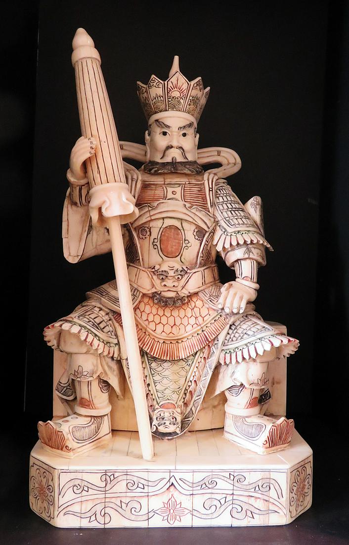Hand Carved Bone Chinese Emperor with Parasol Figurine: Hand carved from bovine bone (circa 1930s), this figurine of a Han Dynasty Emperor with parasol has been created in this style since the Han Dynasty (206 - 220 BCE). This seated emperor with a parasol