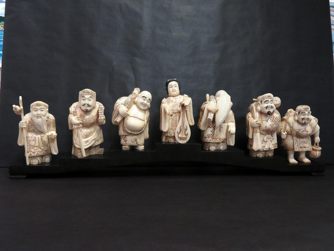 7 Lucky Gods: Hand carved from cattle bone (circa 1930s), these figurines have been created in this style used since the Han Dynasty (206 - 220 BCE). The entire set is constructed of finely fitted and articulated b