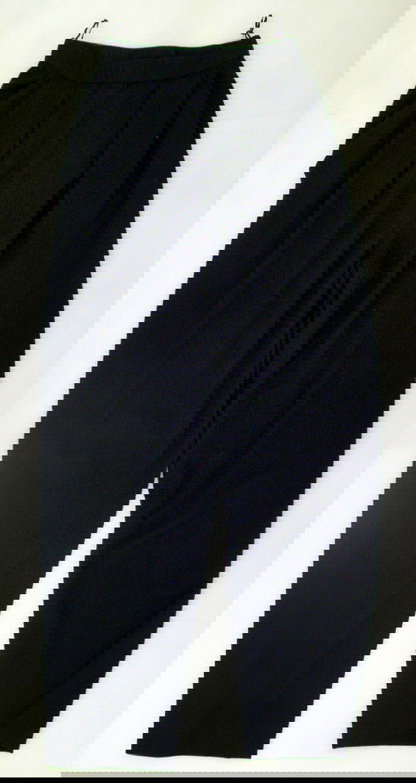 A Pair of Vintage DKNY Pants: Of black wool. Unlined. Circa 1996. Retail price when originally purchased: approx. £400. UK size: circa 8. Please note that the sizing and measurements of vintage clothing and shoes can vary dependi