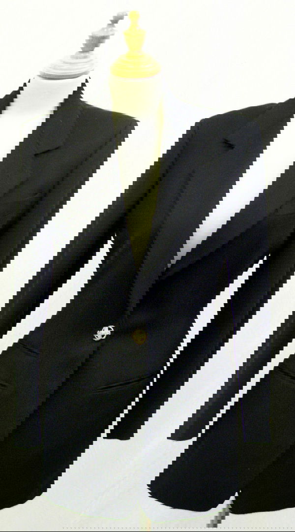 A Vintage DKNY Black Blazer: Of wool and cashmere with gilt metal buttons. Circa 1994. Retail price when originally purchased: approx. £1100. Labeled: size 2, but considered UK size: circa 6. Please note that the sizing and meas