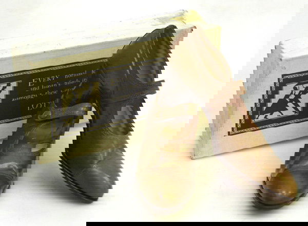 A Pair of Vintage NOS Delta Leather Court Shoes: Of russet brown leather with a single strap and snap closure. Features punched detail on the toe cap, vamp collar and strap. Circa 1920 - 1930. Labelled size 4. Sold with the original box. This lot fo