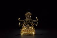 A GILT BRONZE  FIGURE OF SIX ARMS GUANYIN