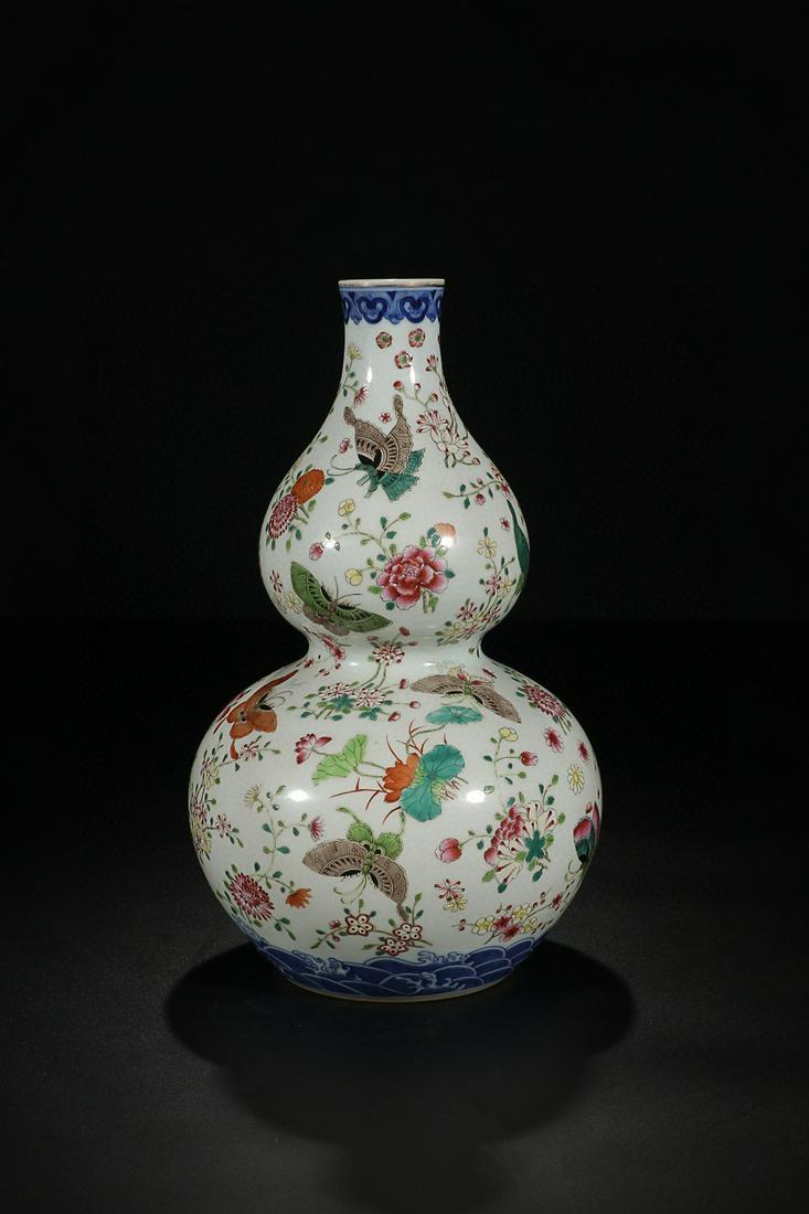 QIANLONG MARK FAMILLE ROSE FLOWERS AND BUTTERFLIES: Time: Qianlong Period 18 Century / Height 11.61 in / Belly-Diameter 7.09 in