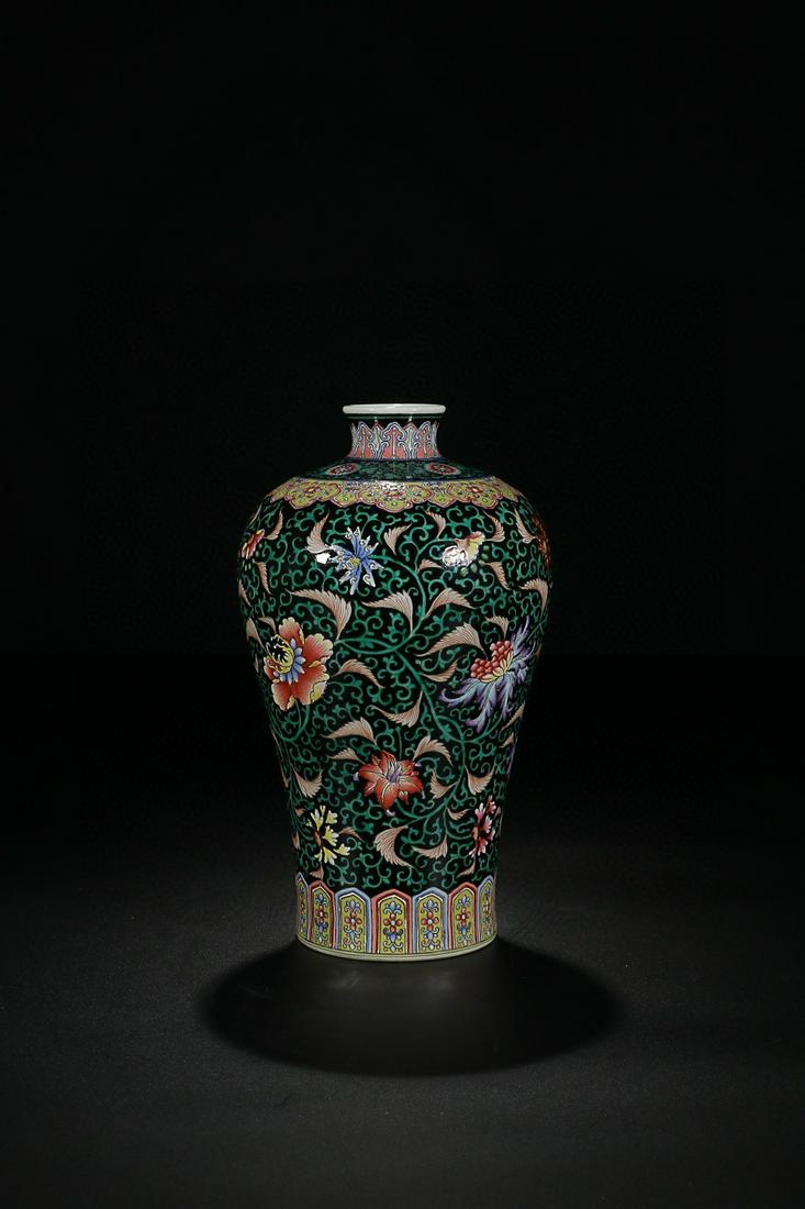 YONGZHENG MARK BLACK GLAZED FAMILLE ROSE FLOWERS AND: Time: Yongzheng Period 18 Century / Height 9.45 in / Belly-Diameter 5.71 in