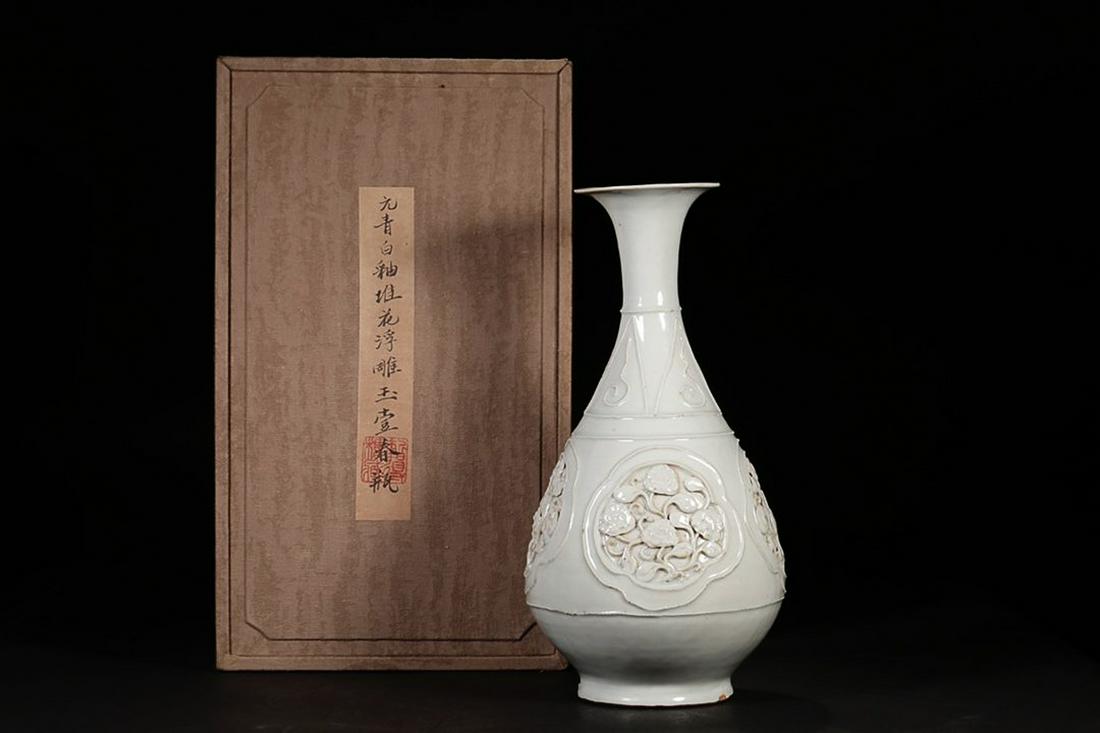 BLUISH WHITE GLAZED EMBOSSING OKHO SPRING VASE: Time: Yuan Dynasty 13-14 Century / Height 11.81 in / Belly-Diameter 5.91 in