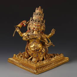 GILT BRONZE NINE-FACED DRAGON-BODY HU'FA ORNAMENT