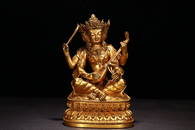 GILT BRONZE TREE-FACED FOUR-ARMED BUDDHA ORNAMENT