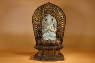 GILT BRONZE AND HETIAN JADE GUAN'YIN ORNAMENT