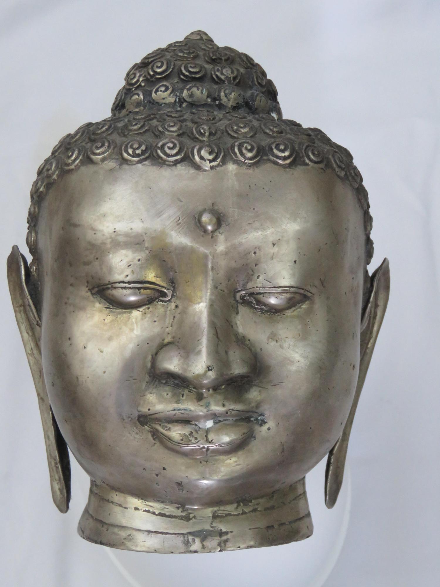 VINTAGE SILVERED BUDDHA HEAD DEVOTIONAL SCULPTURE: Vintage / antique silvered metal Buddha head in a Chinese / Tibetan style. An appealing Buddhist devotional work of art. Measures: 10" x 8" x 7" Condition: Good to very good vintage condition.